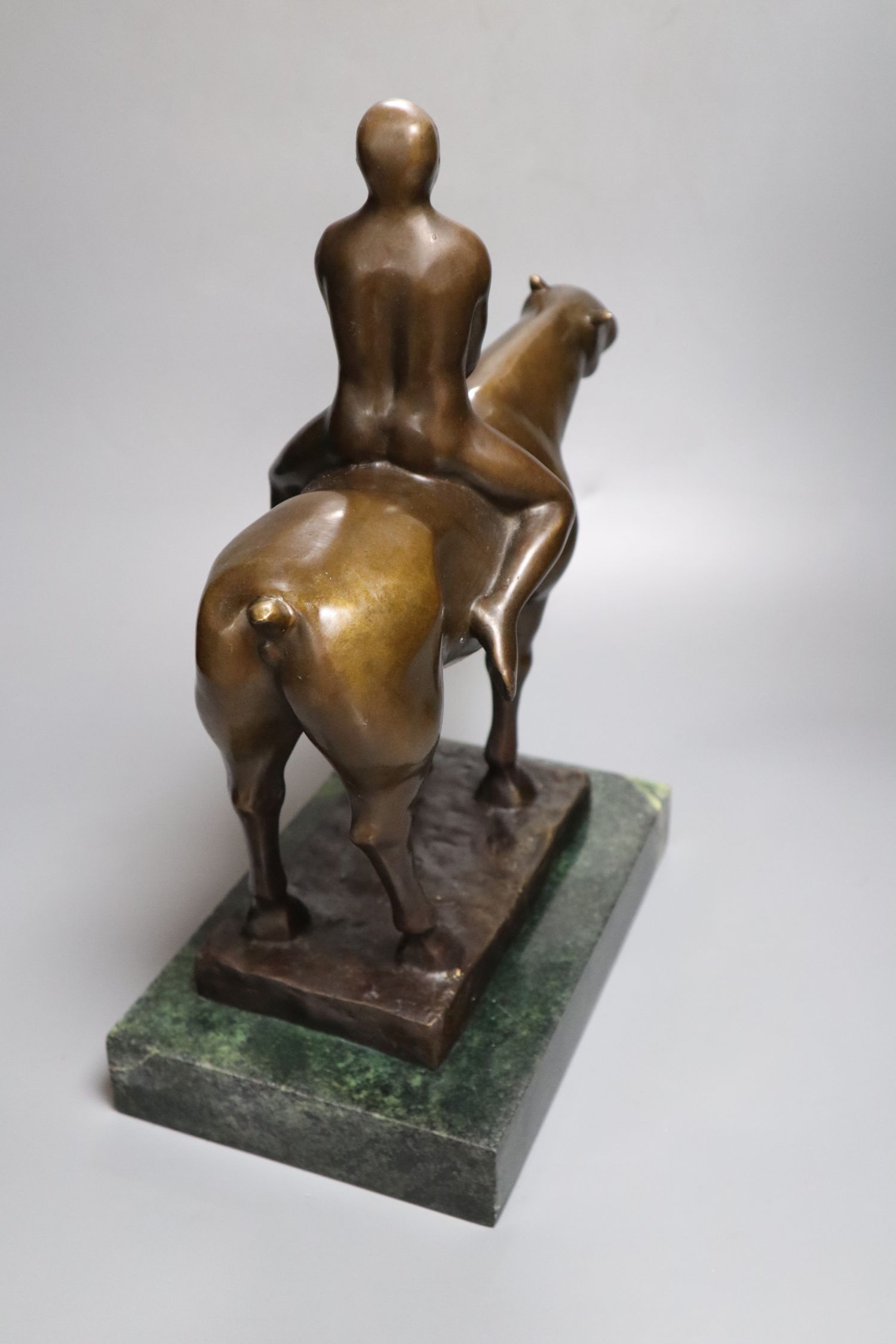 A bronze of a nude man on horseback, signed F. Preiss, height 37cm